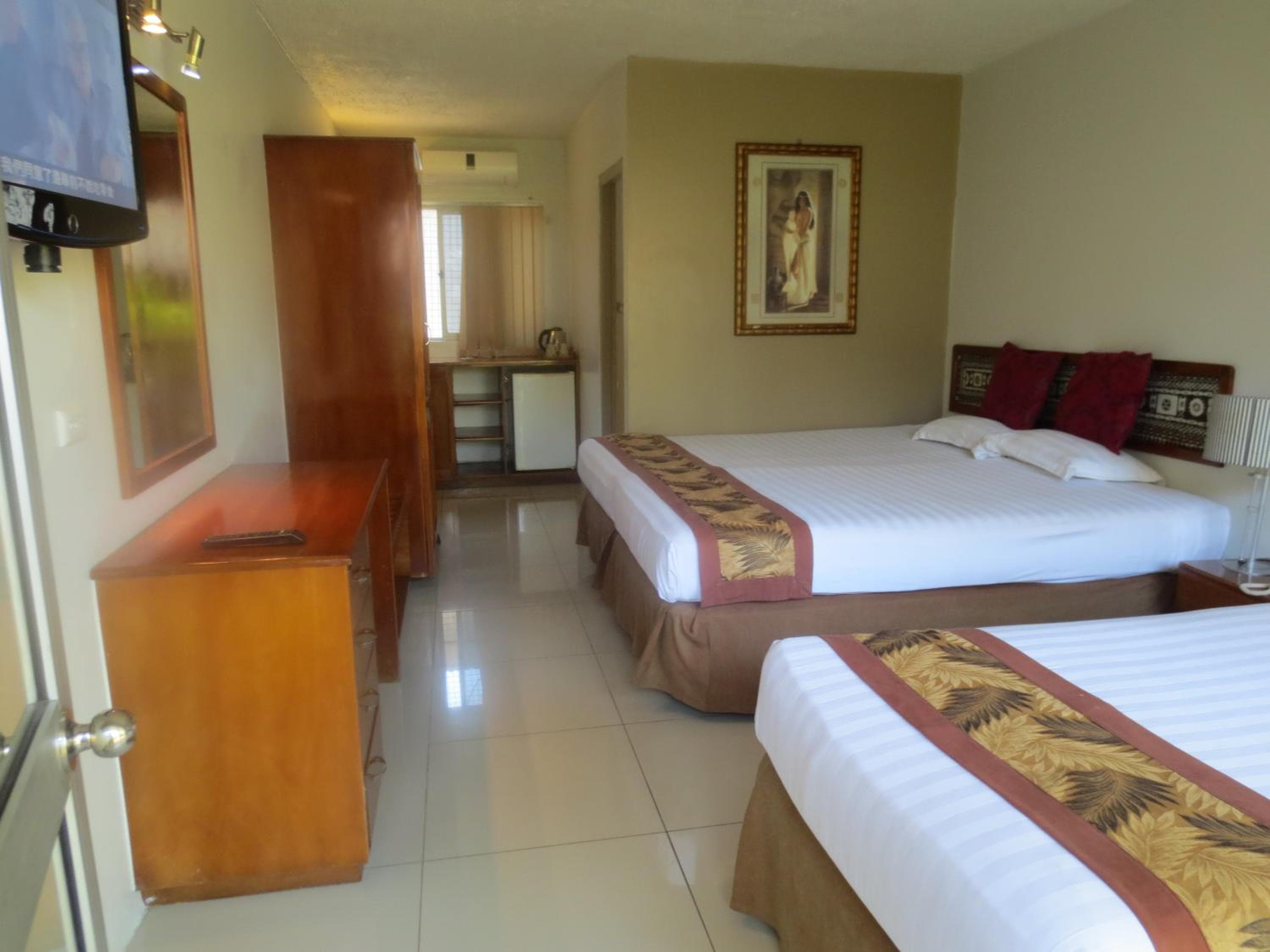 Double Or Twin Room With Pool View at Capricorn International Hotel