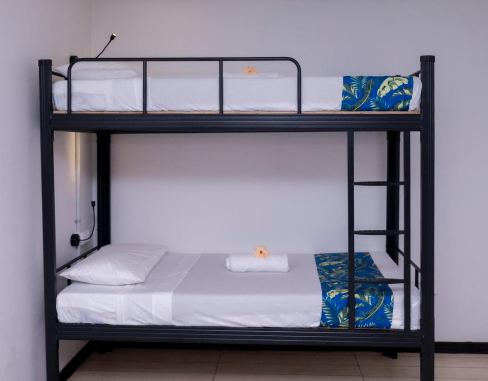 Bunk Bed in Male Dormitory Room at Sailors Beach Fiji