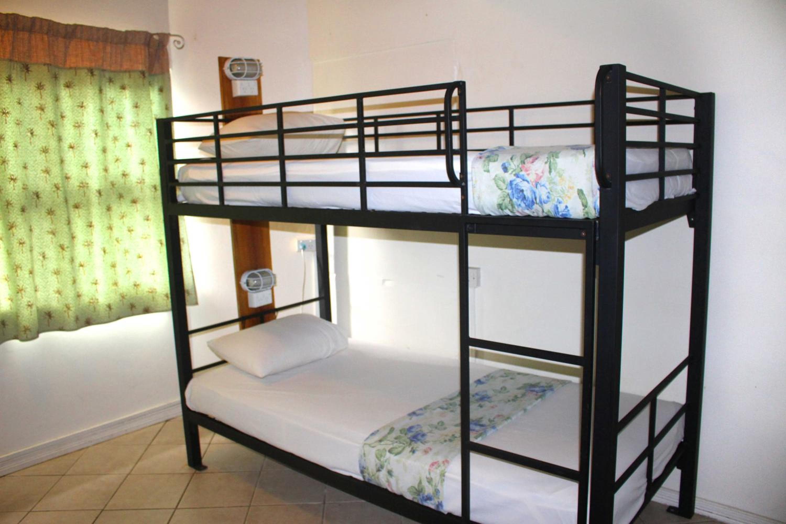 Bed in 4-Bed Mixed Dormitory Room at Bluewater Lodge